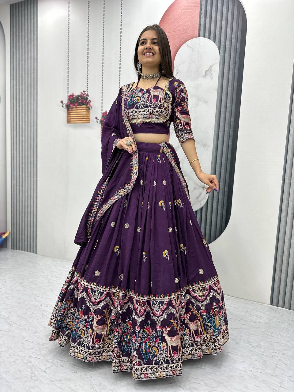 Woman in a purple embroidered traditional Lehenga