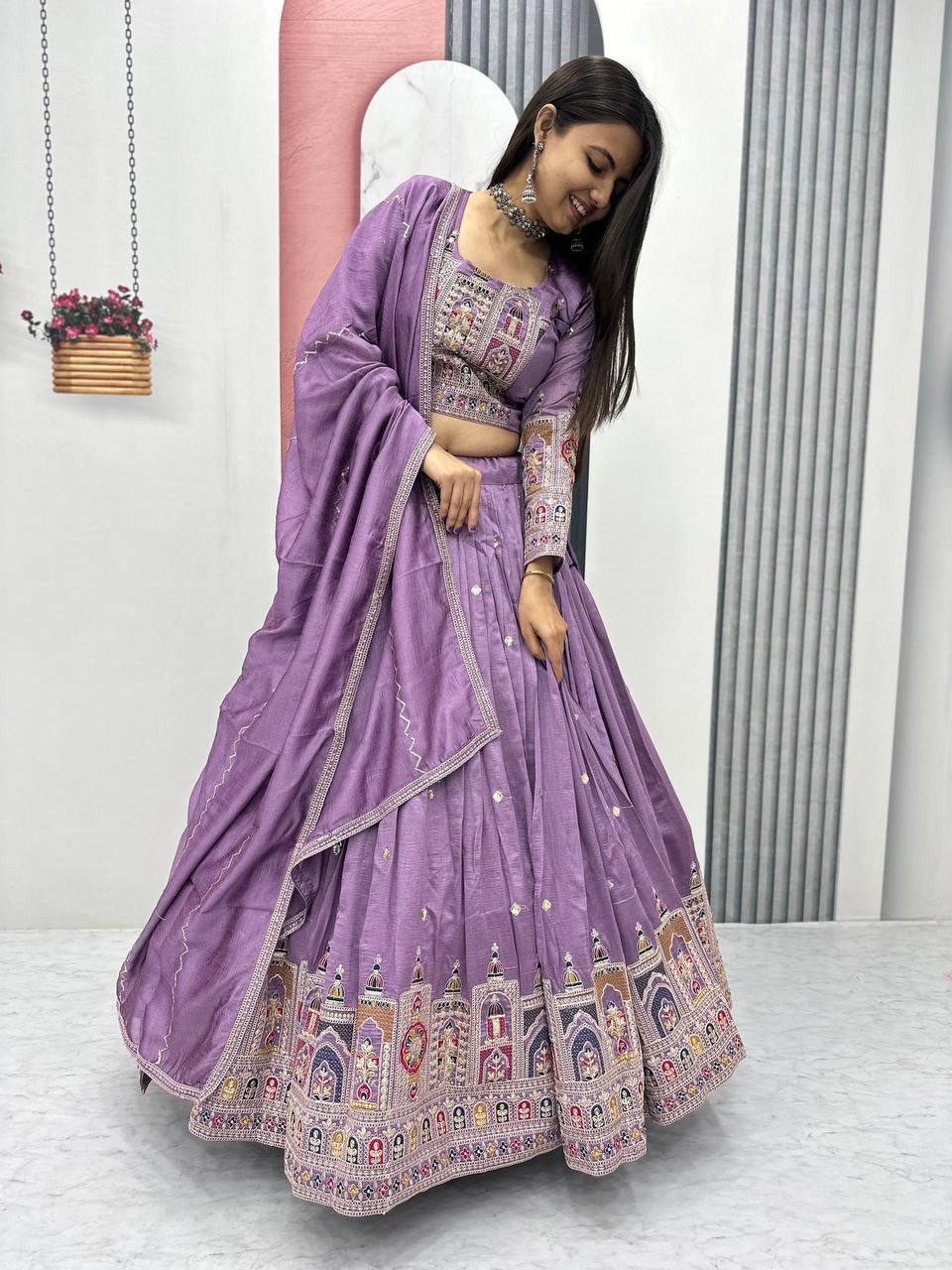 Woman wearing a Lavender embroidered traditional outfit