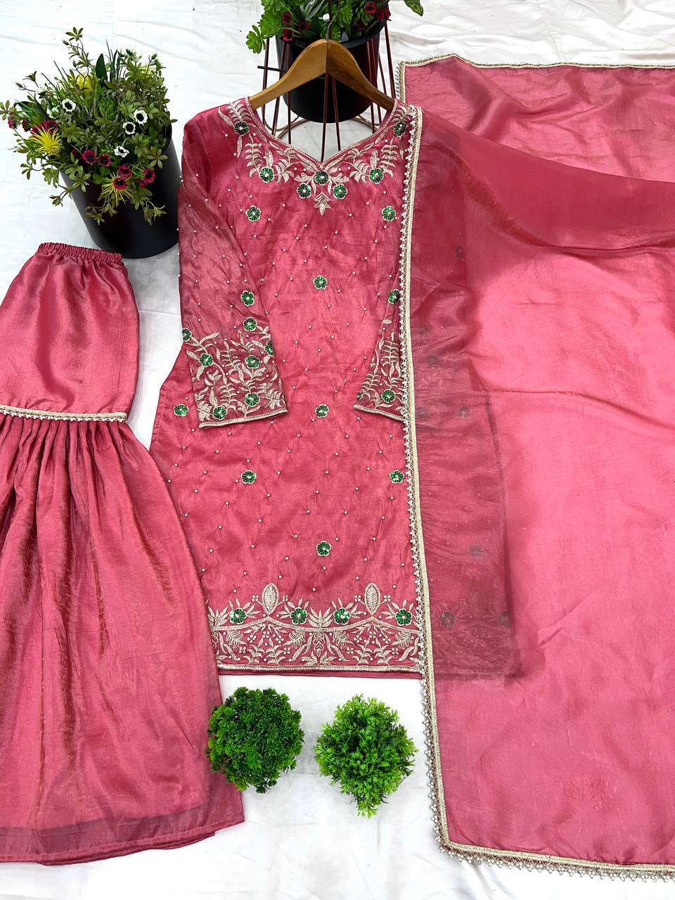Pink embroidered traditional outfit with a matching dupatta