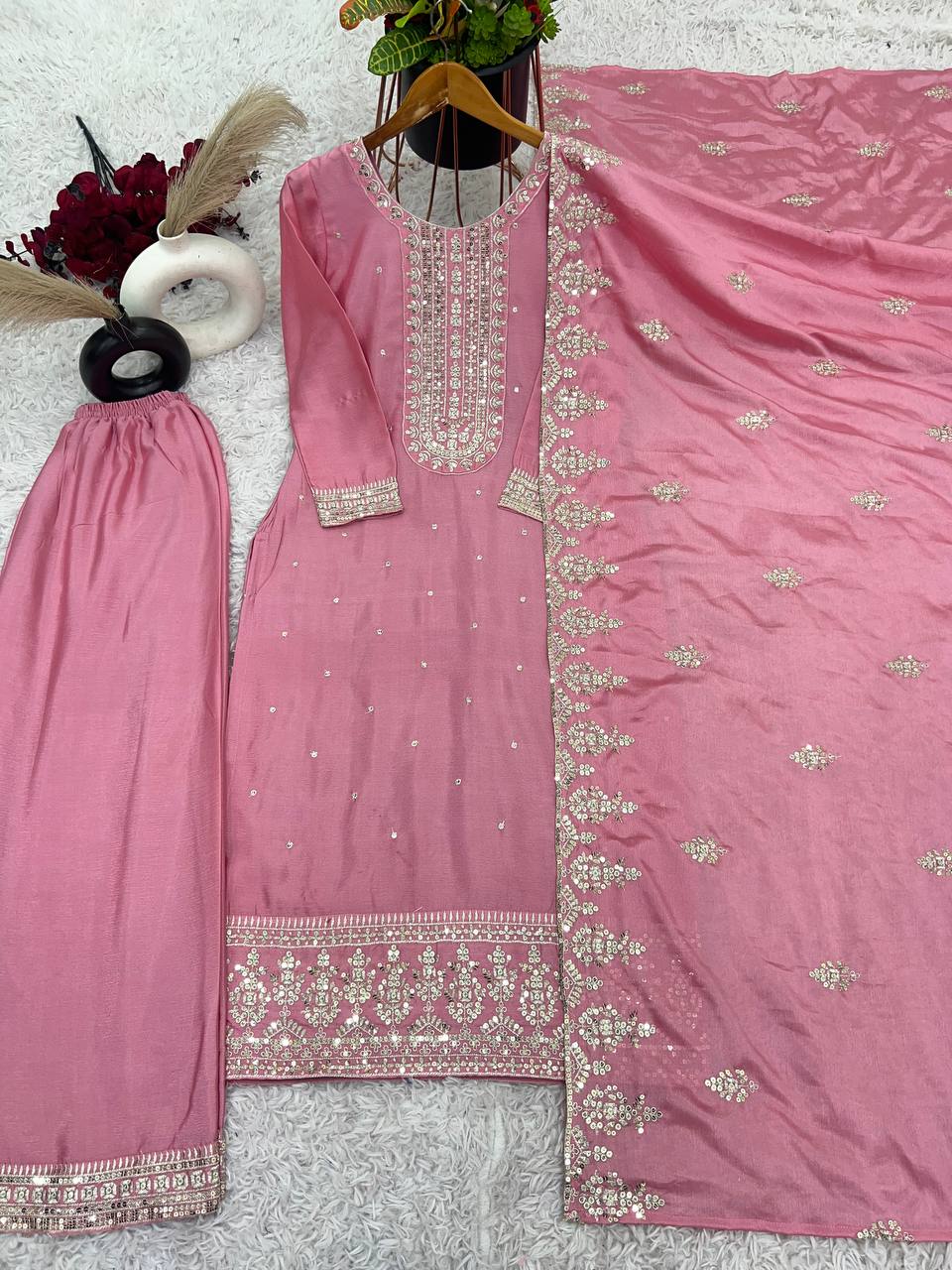 Pink embroidered traditional outfit with a matching dupatta
