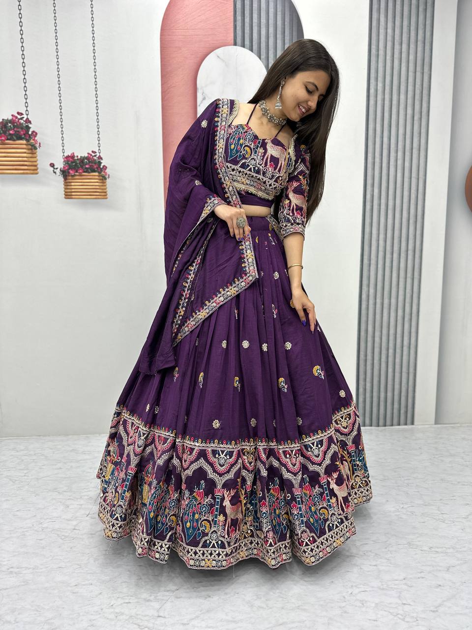 Woman wearing a purple embroidered traditional outfit
