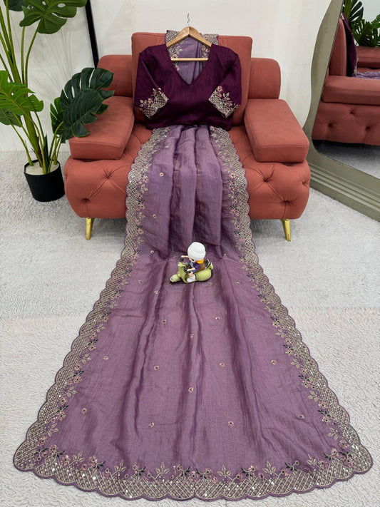 Purple embroidered saree with a blouse.