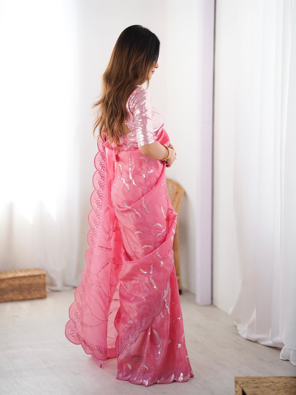 Woman wearing a pink saree with Blouse For Wedding Wear