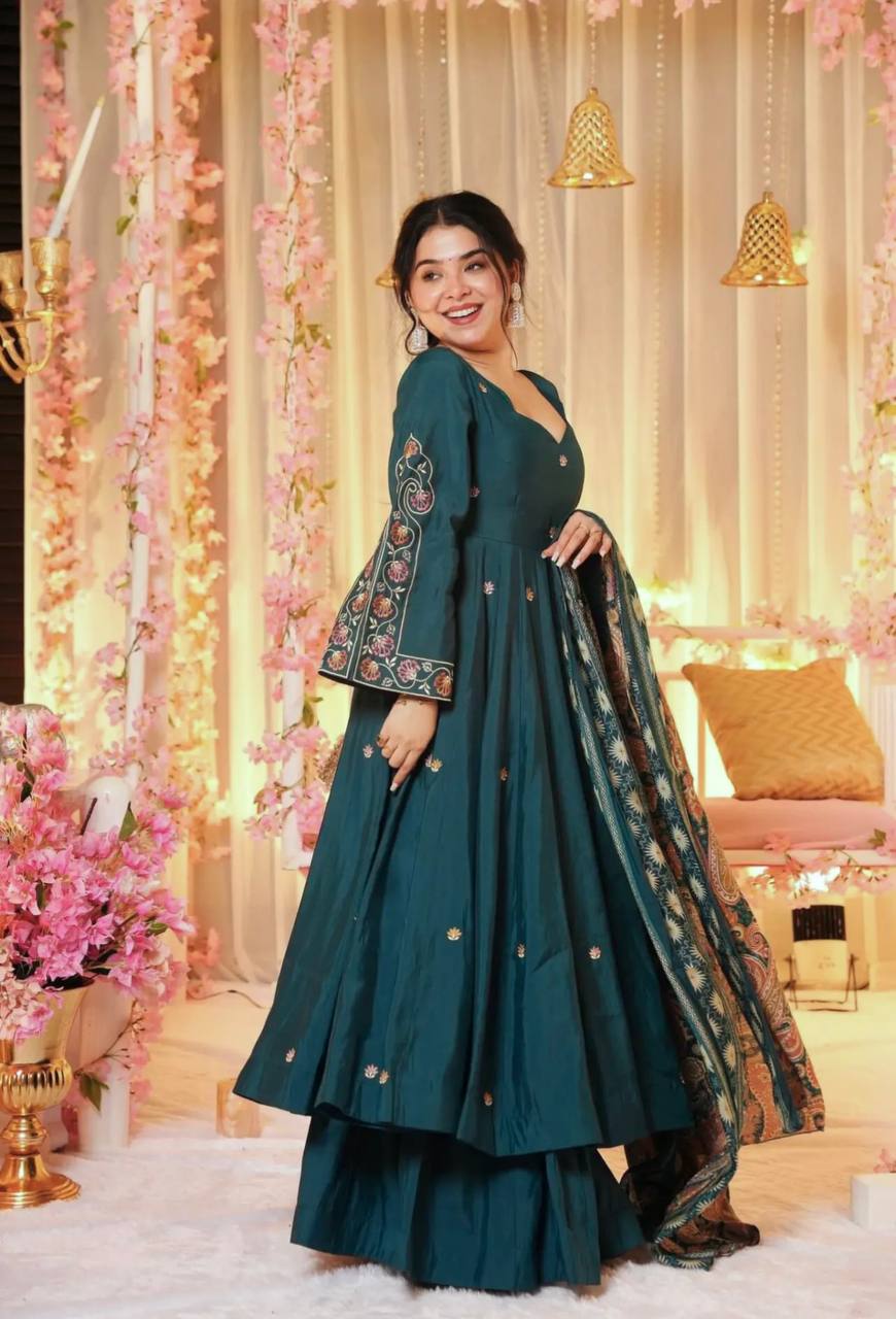 Woman in a teal traditional outfit