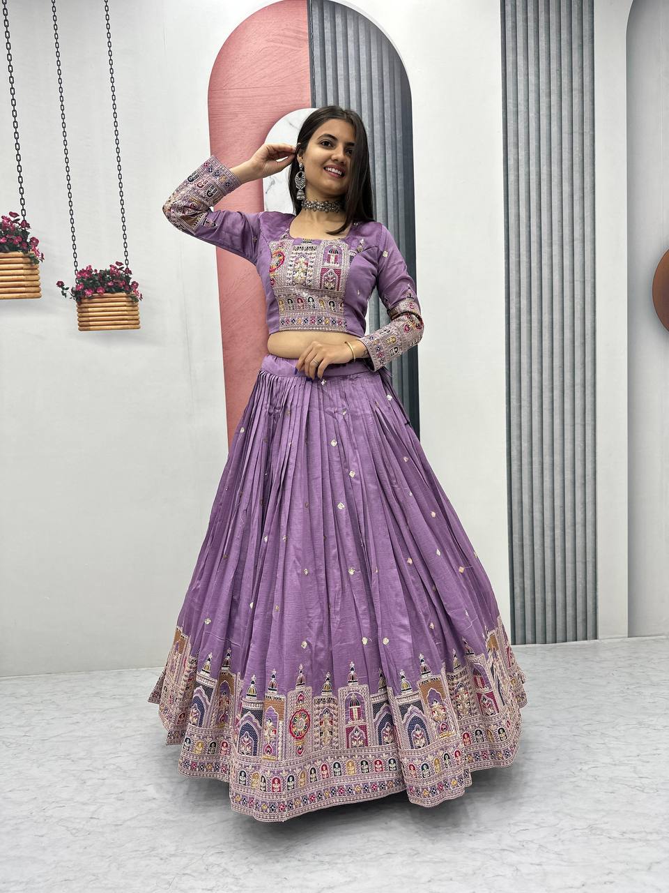 Woman wearing a purple traditional outfit Lehenga