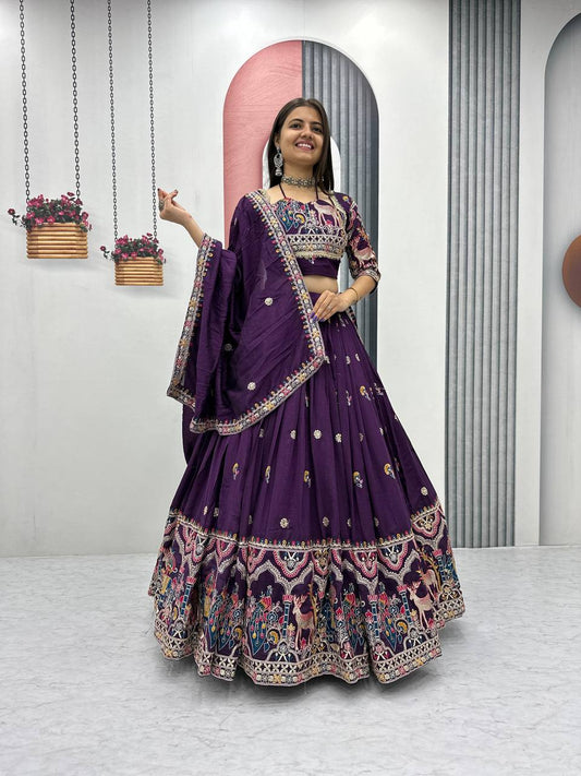 Woman in a purple embroidered traditional outfit .
