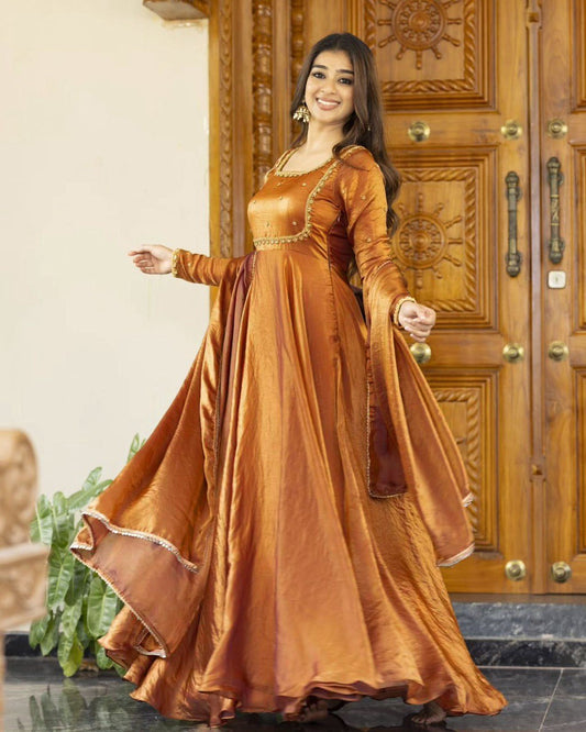 Woman in a long orange dress.